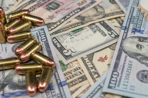 Ammunition and United States currency close-up.