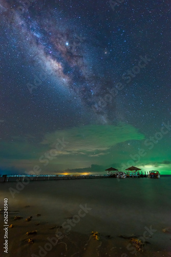 The Milky Way is above the bridge that stretches out into the sea, Koh Mak, Trat, Thailand