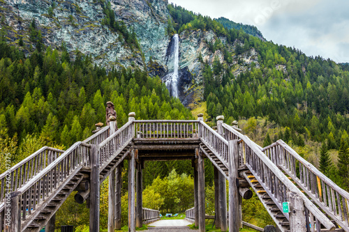 Picturesque waterfall among the cliffs photo