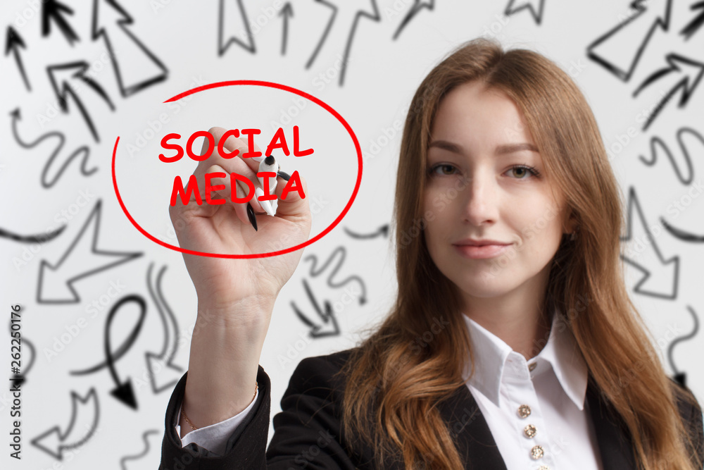 Business, technology, internet and networking concept. Young entrepreneur showing keyword: Social media