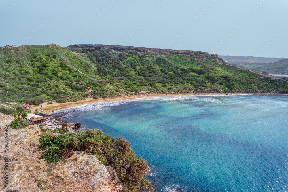 Riviera beach with Golden sand on Gnejna Bay, Mgarr, Malta