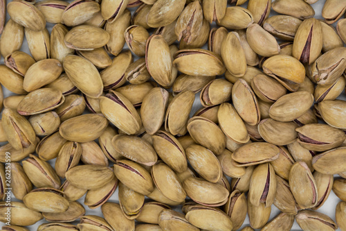 Roasted and salted pistachios in shell (texture, background)