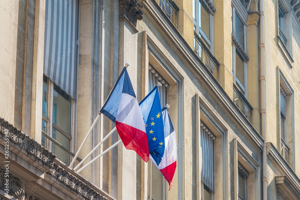 PARIS, FRANCE - APRIL 14, 2019: French flag and EU Community Flag
