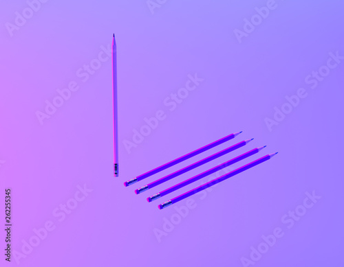 Different pencil in vibrant bold gradient purple and blue holographic colors background. minimal creative concept. The idea about the business leadership.