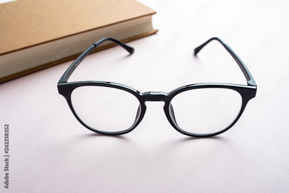 Glasses and book reading background material Glasses and book reading background material
