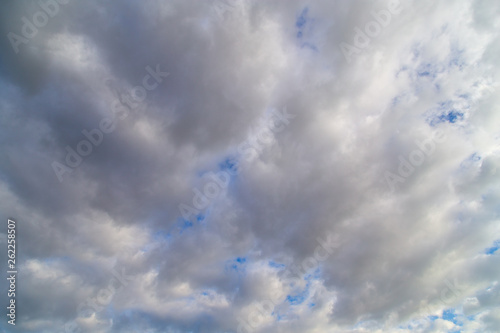 Clouds against the blue sky as a background