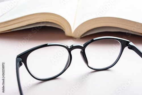 Glasses and book reading background material