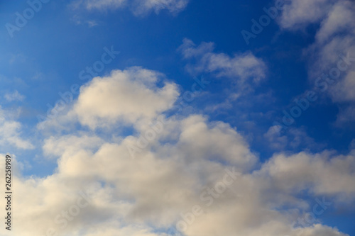 Clouds after rain before sunset as a background