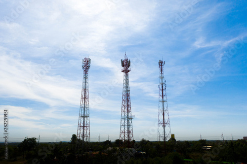 Aerial view of telecom antennas telecommunications towers. Microwave antenna in bright blue sky