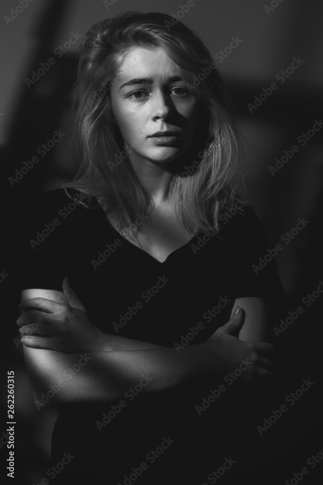 Young woman in shadows