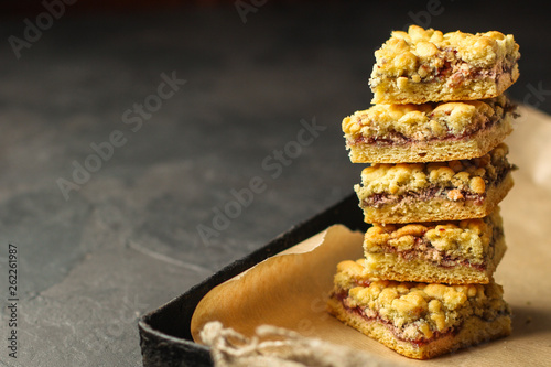 homemade cake with jam and streysel, pastry crumb. Delicious dessert. food background. top photo