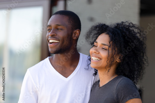 Smiling African American couple standing together outdoors