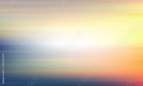Blurred yellow-blue background. Light sky and sea landscape.