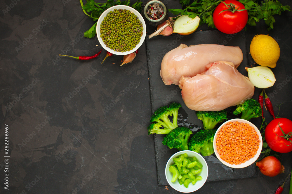 raw chicken meat, vegetables and legumes (lentils, mung beans and more) ingredients, healthy food. copy space. food background. top raw chicken meat, vegetables and legumes (lentils, mung beans and more) ingredients, healthy food. copy space. food background. top