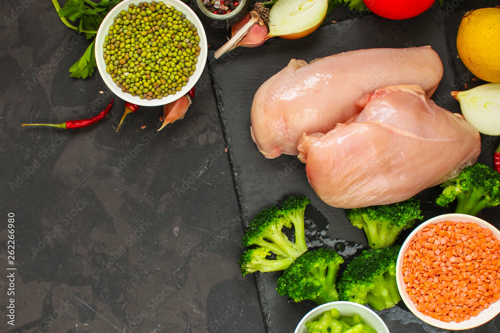raw chicken meat, vegetables and legumes (lentils, mung beans and more) ingredients, healthy food. copy space. food background. top raw chicken meat, vegetables and legumes (lentils, mung beans and more) ingredients, healthy food. copy space. food background. top