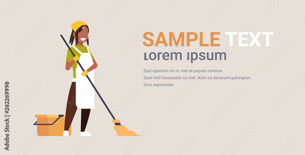 Fototapeta premium woman in gloves and apron washing floor african american girl using mop housewife doing housework cleaning concept flat horizontal copy space full length