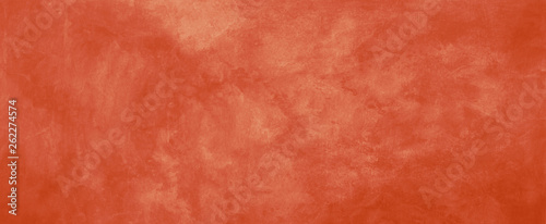 Orange background with old vintage grunge texture, solid warm orange color for halloween, autumn, and thanksgiving designs