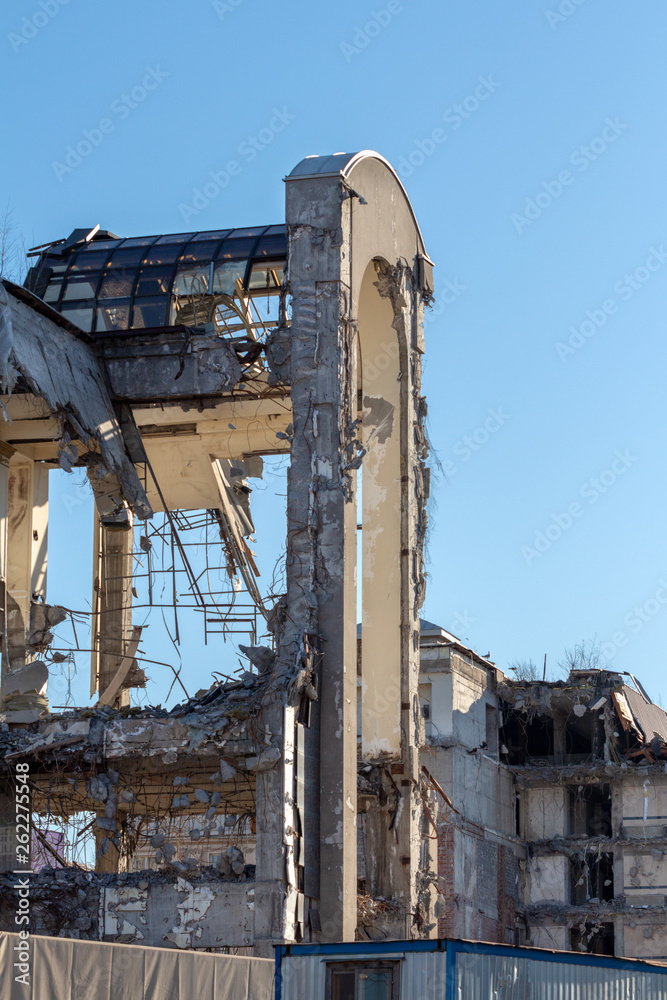 The unfinished demolition of a building in a modern city. destruction and debris of a house