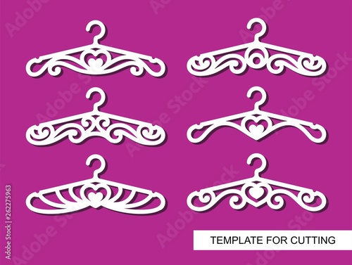 Set of decorative clothes hangers for atelier, wedding salon, boutique or store. White objects on pink background. Template for laser cutting, wood carving, paper cut and printing. Vector illustration