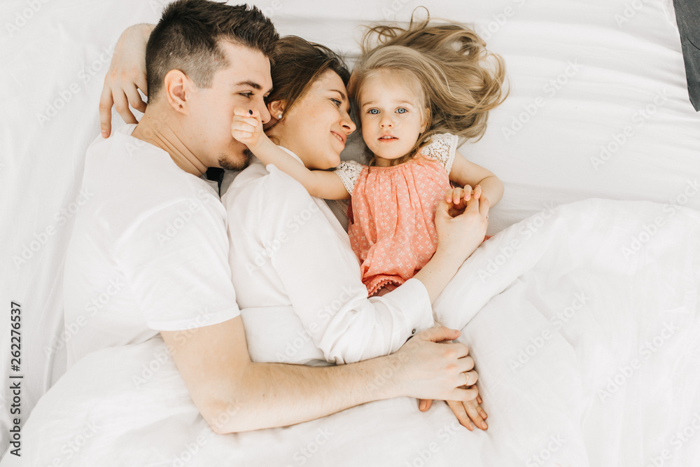  happy family in bed