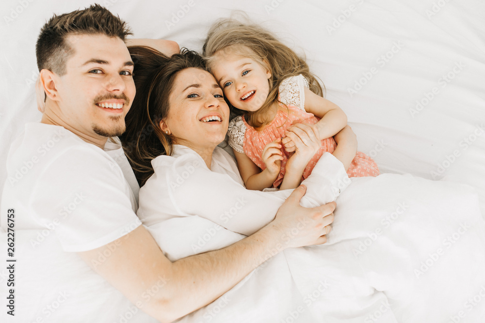  happy family in bed