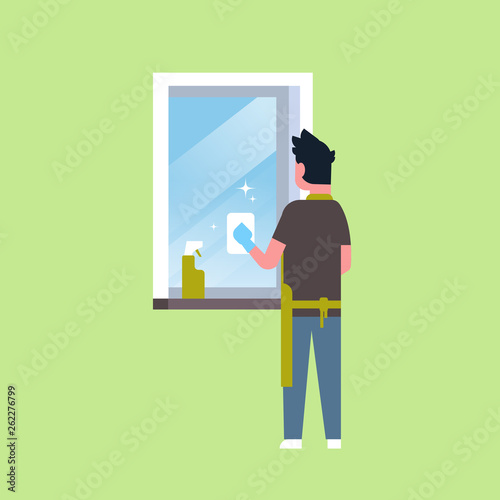 man in gloves and apron cleaning window with rag cleaner spray rear view guy doing housework concept flat male character full length