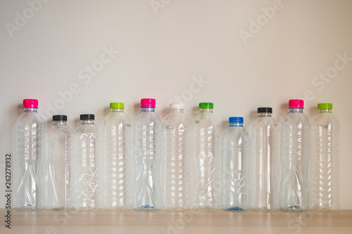 set of many plastic bottle on wood table, recycling concept