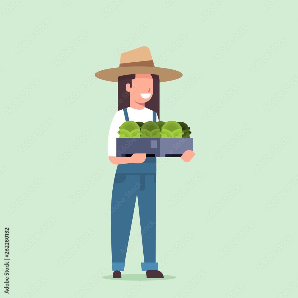 happy female farmer holding box with green fresh lettuce cabbage woman harvesting vegetables agricultural worker in uniform eco farming concept flat full length
