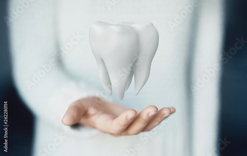Dental care, tooth on hand © Aldeca Productions