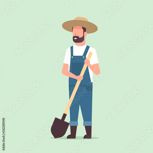 gardener holding shovel country man working in garden gardening eco farming concept full length