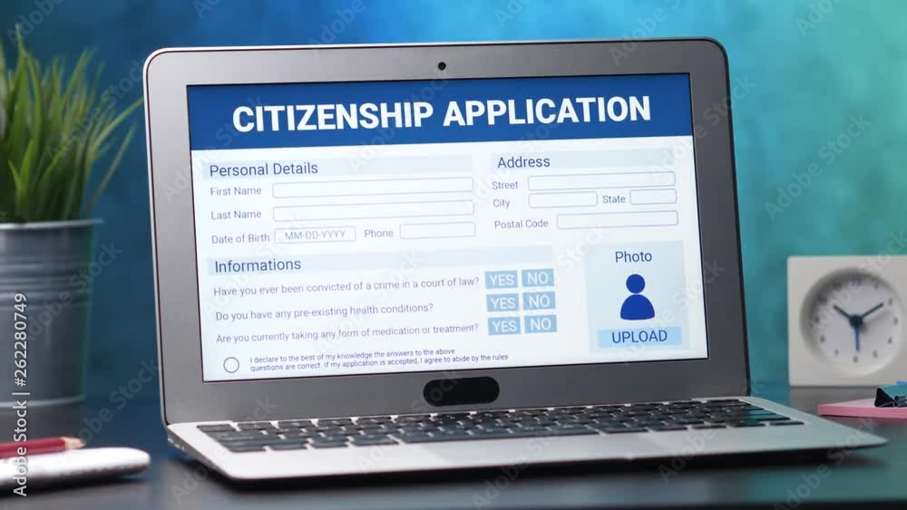 Laptop computer with citizenship application form on its display. Camera turning slowly around the desk. Laptop computer with citizenship application form on its display. Camera turning slowly around the desk.