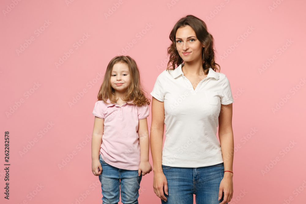 Woman in light clothes have fun with cute child baby girl. Mother, little kid daughter isolated on pastel pink wall background, studio portrait. Mother's Day, love family, parenthood childhood concept Woman in light clothes have fun with cute child baby girl. Mother, little kid daughter isolated on pastel pink wall background, studio portrait. Mother's Day, love family, parenthood childhood concept
