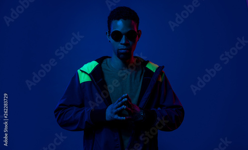 enigmatic african man in sunglasses photo