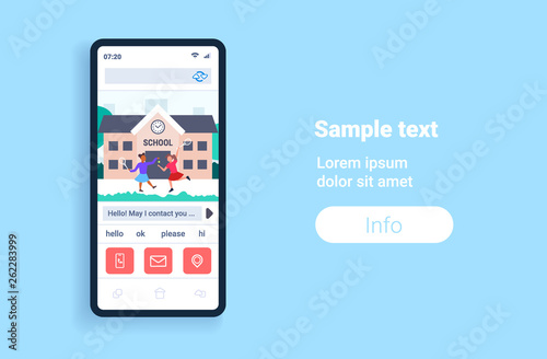 mix race schoolgirls playing tennis in front of school building primary schoolchildren having fun online mobile app smartphone screen flat full length horizontal copy space