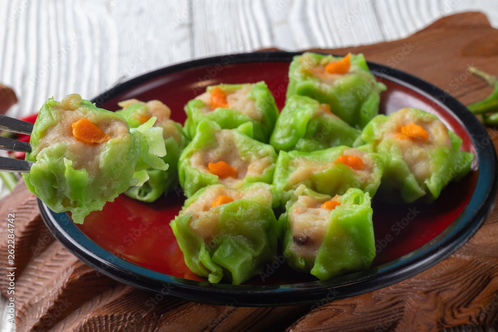 Chinese steamed pork dumpling dim sum on plate Chinese steamed pork dumpling dim sum on plate