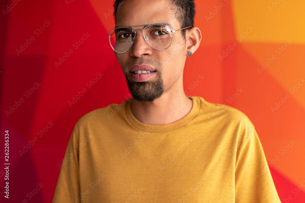 Fototapeta premium closeup portrait of black man over colorful background