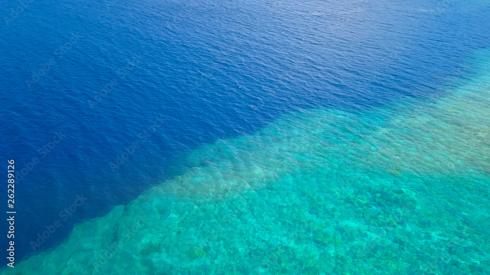 Obraz premium Beautiful nature of blue sea sand and Turquoise color water waves at Atauro Island, Timor Leste