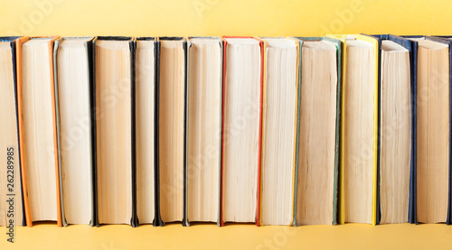 Row of old colorful books. Education background. Back to school. Copy space for text.