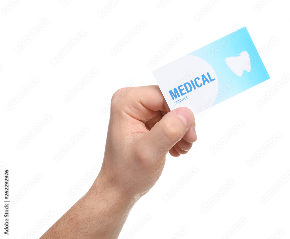 Man holding business card isolated on white, closeup. Dental medical service
