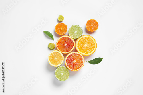 Composition with different citrus fruits on white background  top view