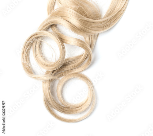 Curly blond hair on white background, top view. Hairdresser service