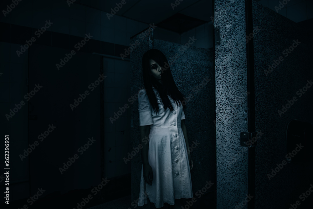 Portrait of asian woman make up ghost face with blood,Horror scene,Scary background,Halloween poster,Thailand people