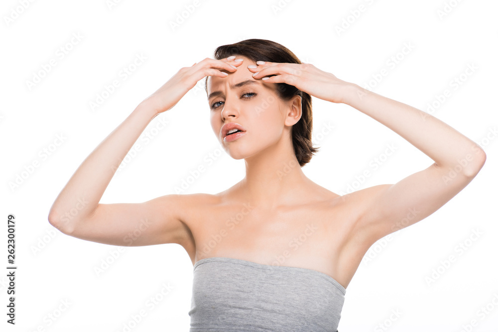 Fototapeta premium attractive brunette girl pressing forehead isolated on white