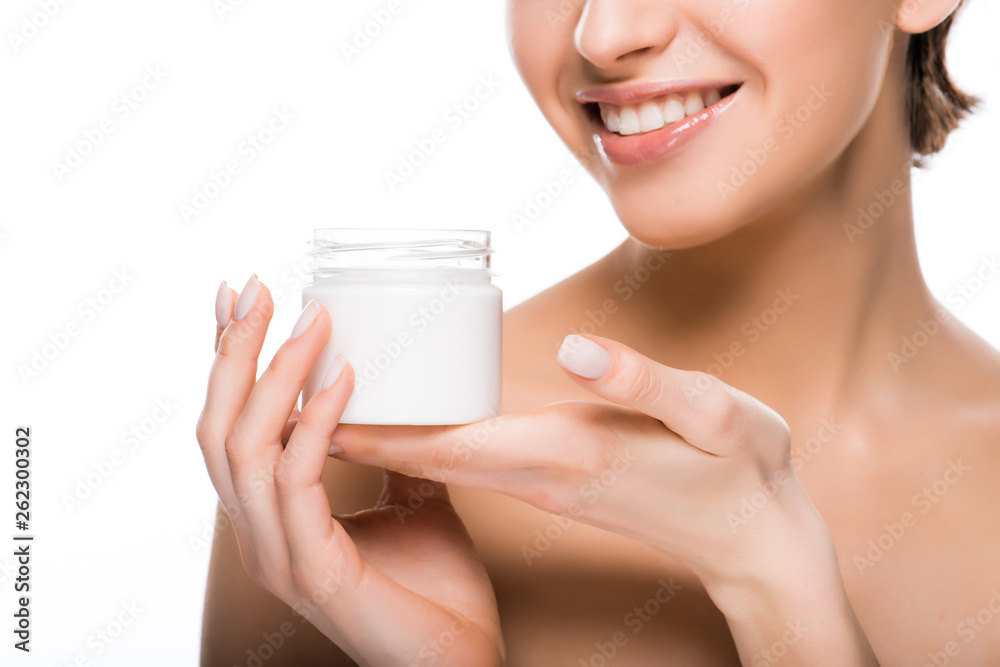 cropped view of happy girl holding cosmetic cream in hands isolated on white cropped view of happy girl holding cosmetic cream in hands isolated on white
