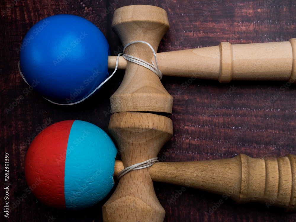Traditional Japanese wood toy Kendama on wooden background, Symbol of Japanese boy toy. Traditional Japanese wood toy Kendama on wooden background, Symbol of Japanese boy toy.