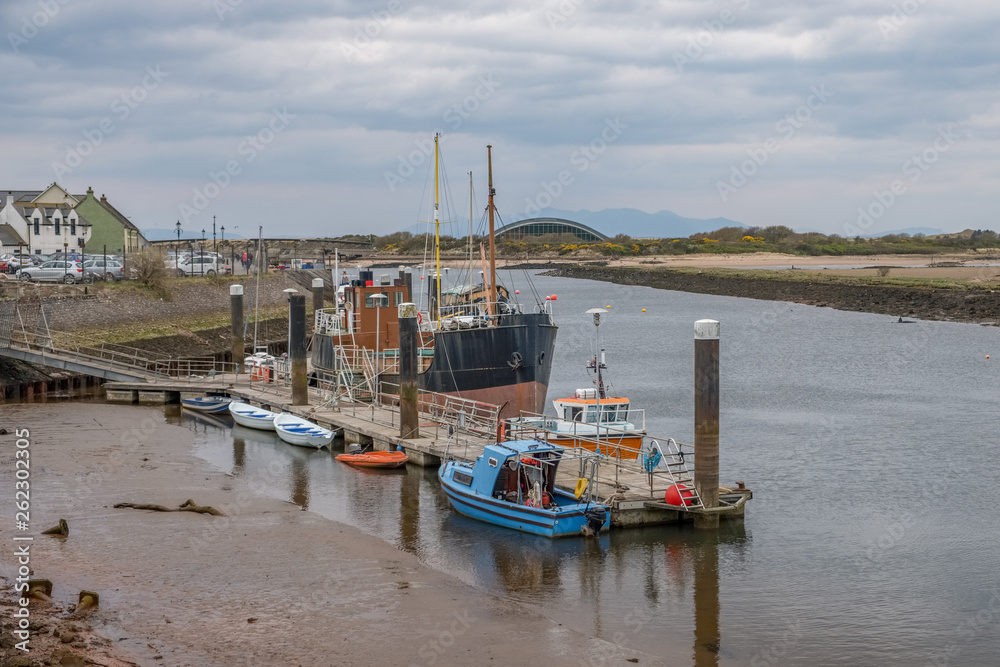 Irvine Harbour in Ayrshire Scotland looking Over some Small Boats with the Old Science Museum and Arran in the far Distance