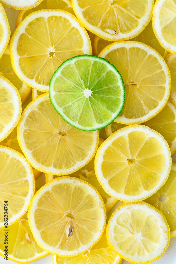 Lemon slices with one cut lime slice closeup