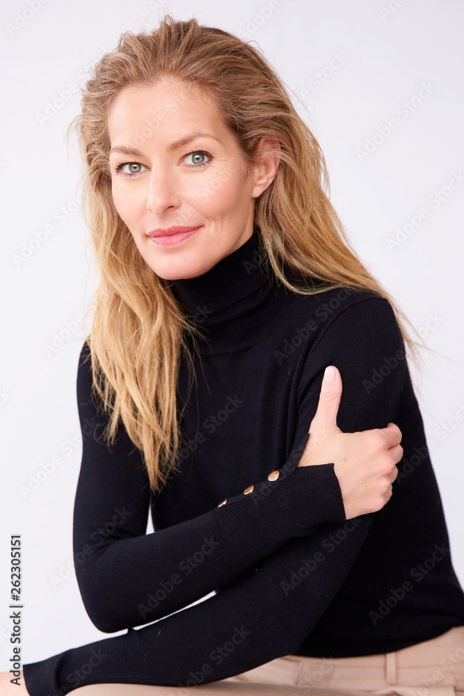 Beautiful mature woman studio portrait at isolated background Beautiful mature woman studio portrait at isolated background