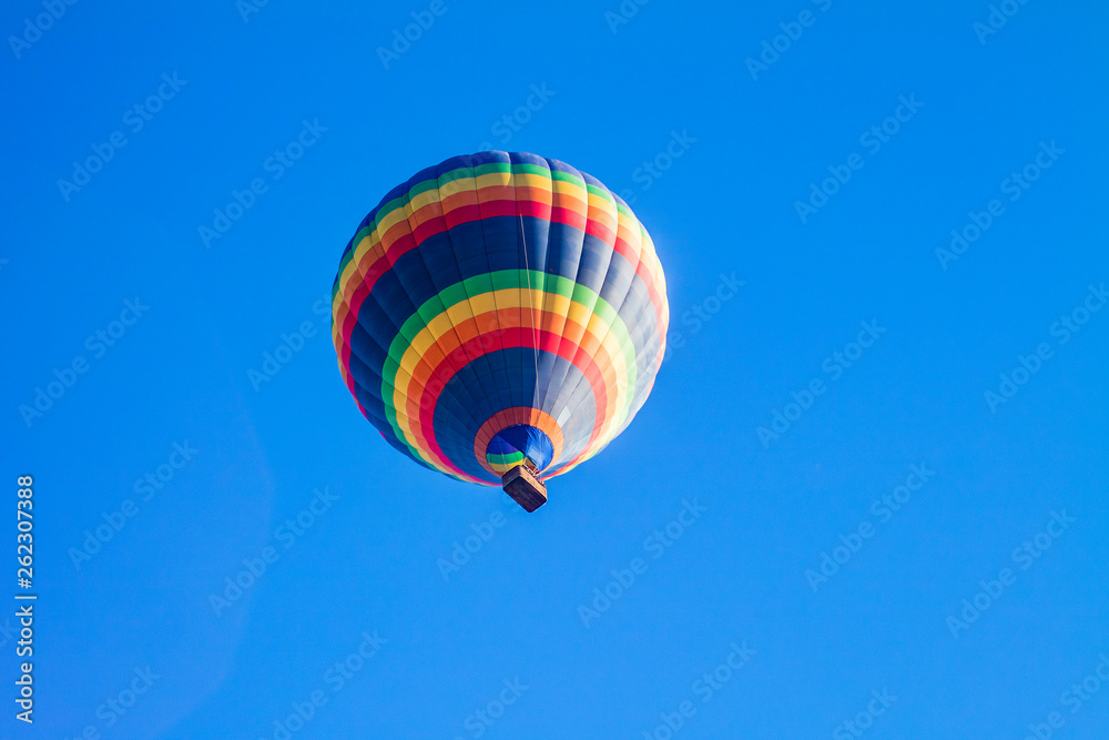 Naklejka premium Colorful hot air balloons over blue sky.