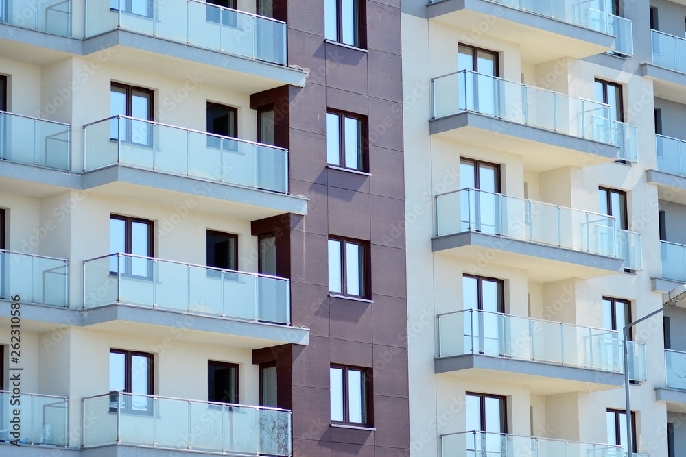 Modern apartment buildings on a sunny day with a blue sky. Facade of a modern apartment building